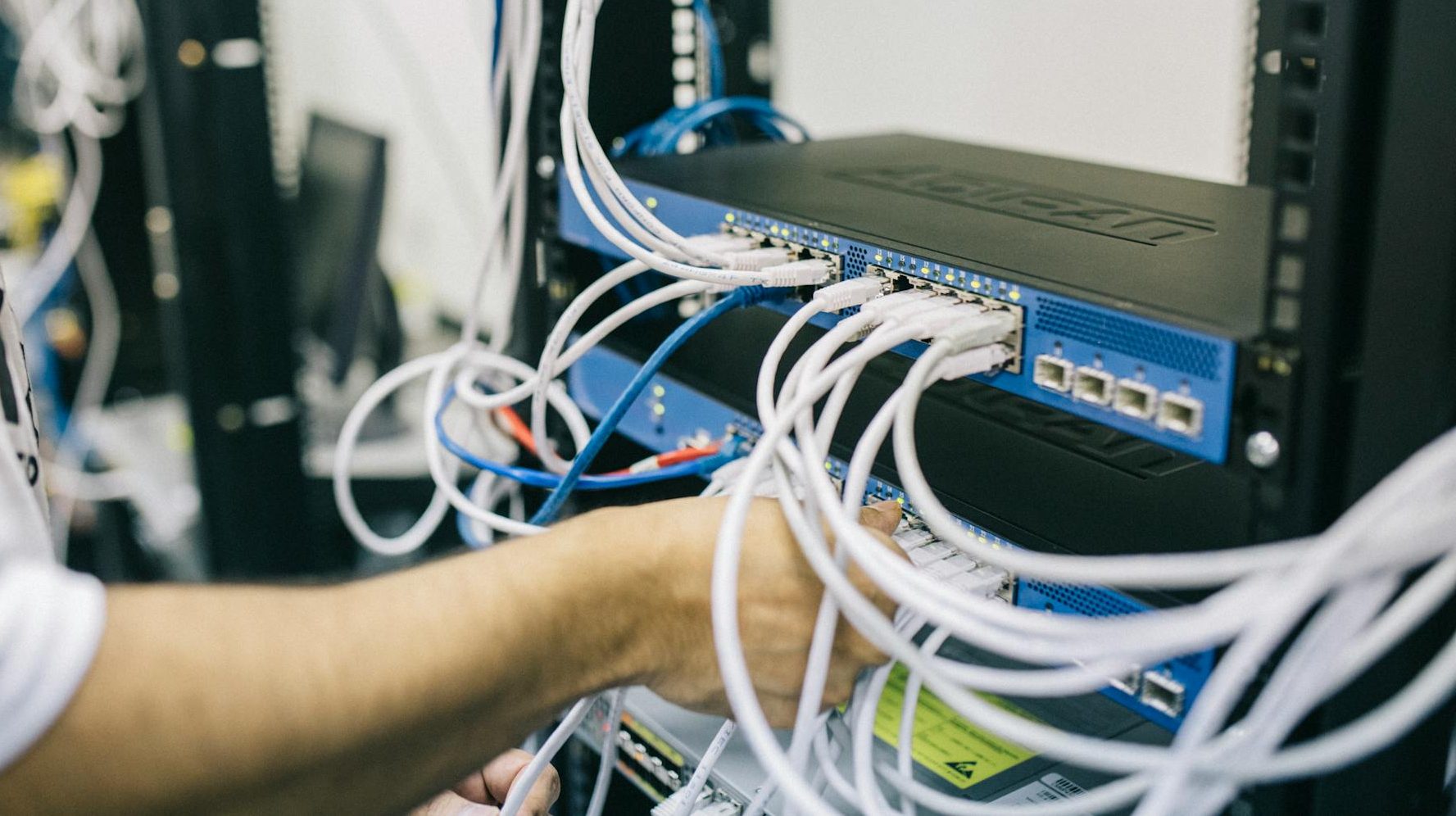 electronics engineer fixing cables on server